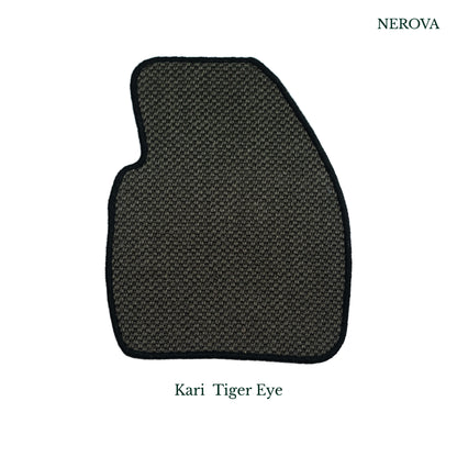 Nerova Kari Tiger Eye sisal mat in BMW X3 driver footwell — dark charcoal natural sisal with black rubber heel pad, luxury car mat