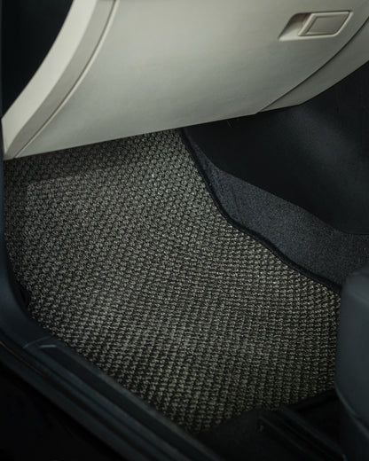 Nerova Kari Tiger Eye natural sisal car mats fully installed in BMW X3 — front and rear rows, charcoal sisal with cream leather interior