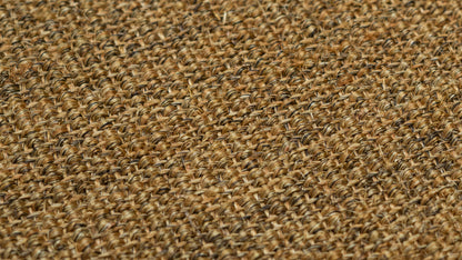 Nerova Tobacco sisal texture closeup — flat bouclé weave warm brown natural sisal fibre detail